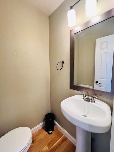 323 South Towanda Avenue, Unit 4 Normal, IL 61761 - Photo 12 of 33 a bathroom with a sink and a toilet