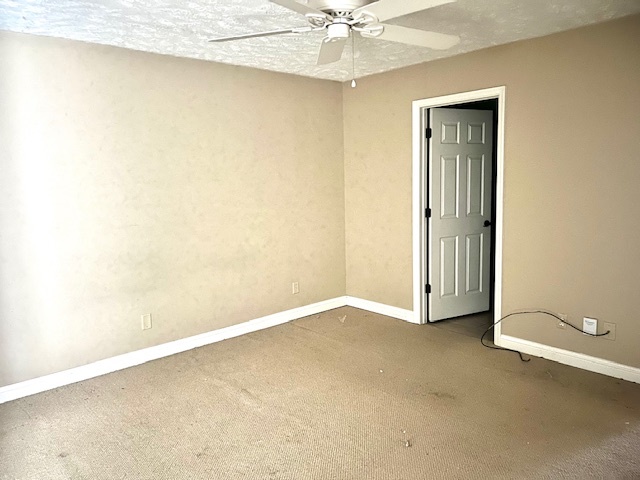 323 South Towanda Avenue, Unit 4 Normal, IL 61761 - Photo 18 of 33 an empty room with a ceiling fan and closet