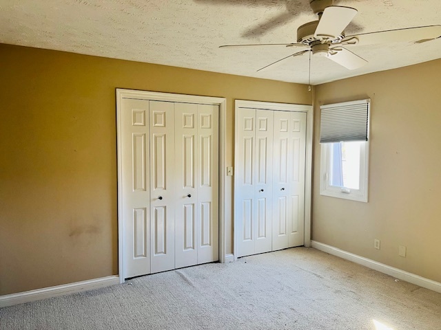 323 South Towanda Avenue, Unit 4 Normal, IL 61761 - Photo 20 of 33 a view of a room with a ceiling fan and a window