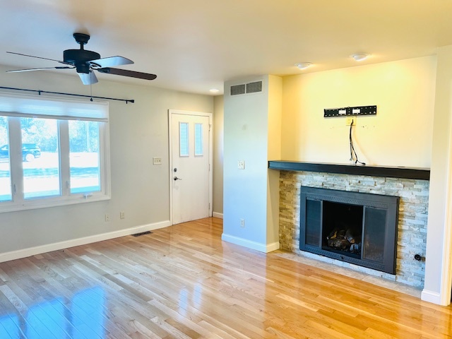 323 South Towanda Avenue, Unit 4 Normal, IL 61761 - Photo 2 of 33 a view of an empty room with a fireplace and a window