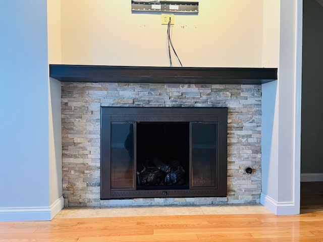 323 South Towanda Avenue, Unit 4 Normal, IL 61761 - Photo 3 of 33 a view of a living room that has a fireplace