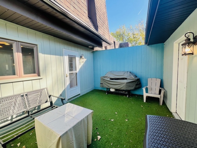 323 South Towanda Avenue, Unit 4 Normal, IL 61761 - Photo 31 of 33 a backyard of a house with a table and chairs