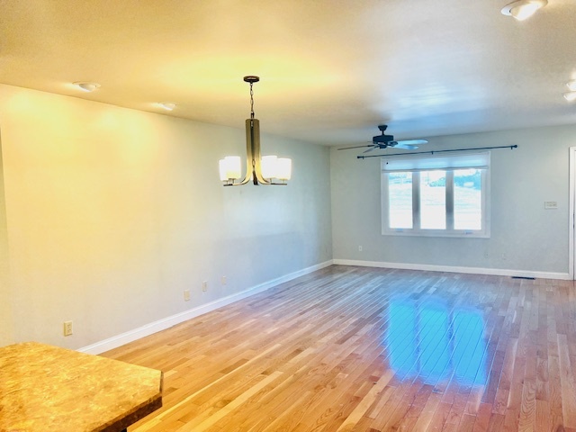 323 South Towanda Avenue, Unit 4 Normal, IL 61761 - Photo 4 of 33 a view of empty room with wooden floor