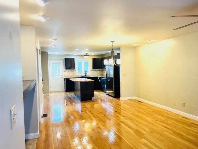 323 South Towanda Avenue, Unit 4 Normal, IL 61761 - Photo 5 of 33 a view of kitchen with kitchen island a sink dishwasher stove and oven