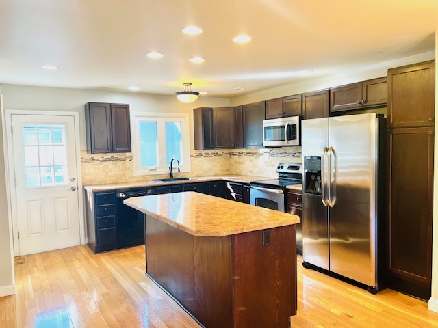 323 South Towanda Avenue, Unit 4 Normal, IL 61761 - Photo 8 of 33 a kitchen with stainless steel appliances granite countertop a sink stove and refrigerator