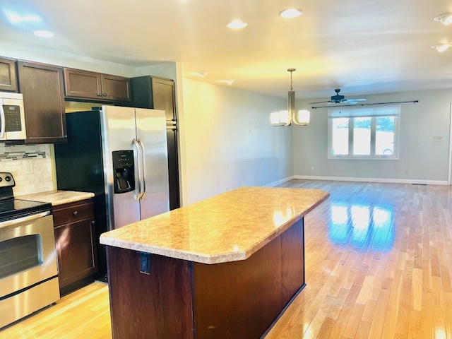323 South Towanda Avenue, Unit 4 Normal, IL 61761 - Photo 9 of 33 a kitchen with stainless steel appliances granite countertop a sink stove and refrigerator