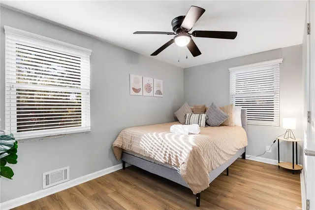 a bedroom with a large bed and a window
