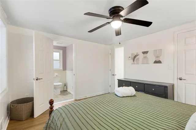 a bedroom that has a bed and a chandelier