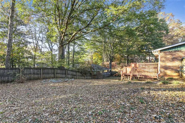 a backyard of a house with lots of green space