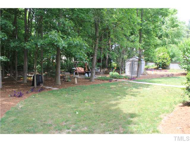 5121 Six Point Trail Raleigh, NC 27616 - Photo 3 of 3 a backyard of a house with table and chairs