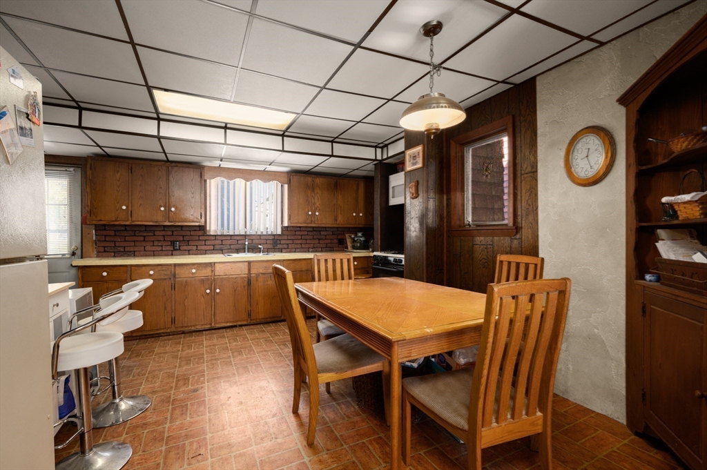 288 Cedar Street Somerville, MA 02145 - Photo 14 of 23 a large kitchen with a table and chairs
