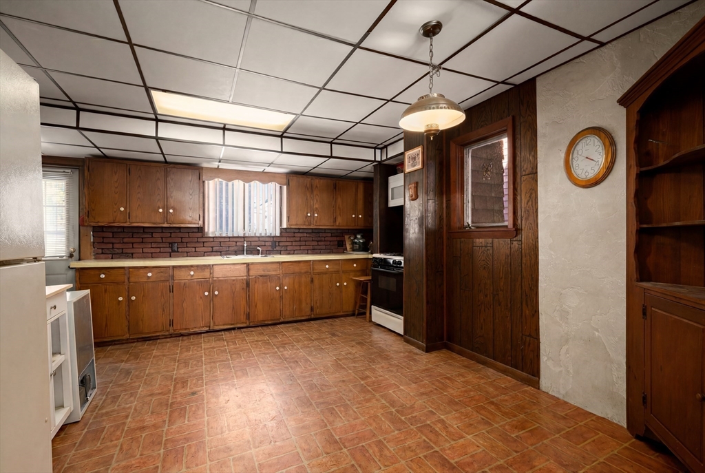 288 Cedar Street Somerville, MA 02145 - Photo 16 of 23 a large kitchen with stainless steel appliances granite countertop a refrigerator a oven a sink and dishwasher