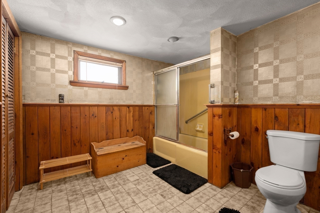 288 Cedar Street Somerville, MA 02145 - Photo 19 of 23 a bathroom with a toilet a sink and mirror