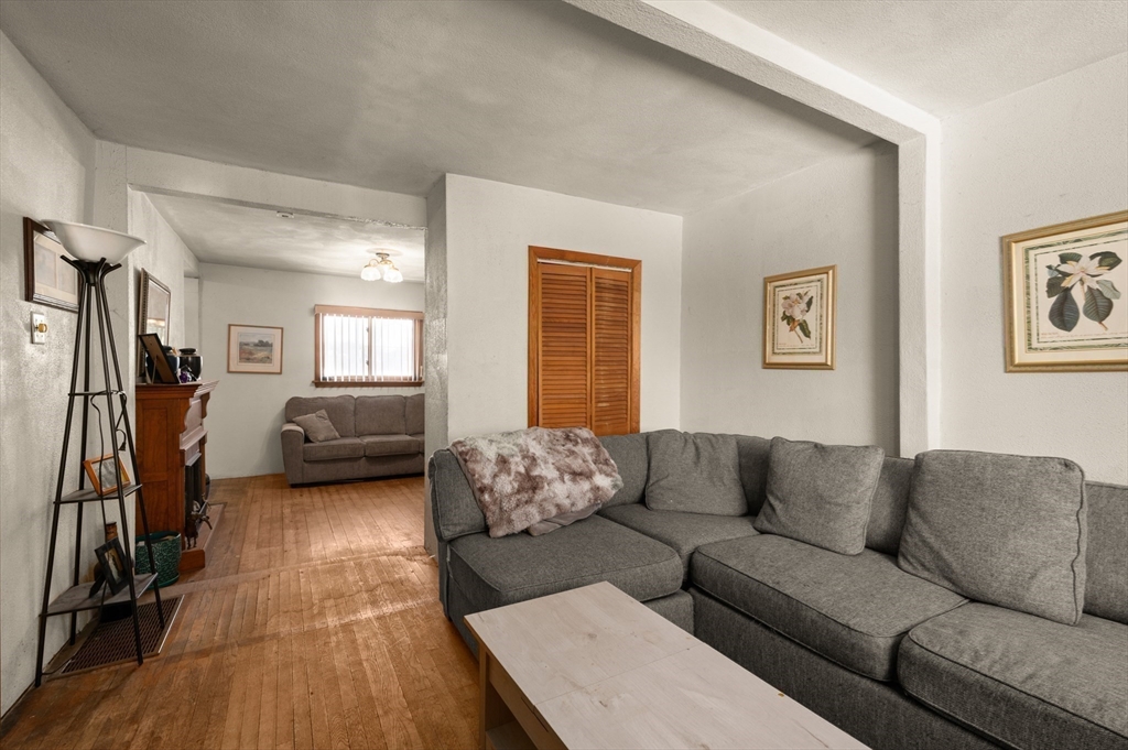 288 Cedar Street Somerville, MA 02145 - Photo 8 of 23 a living room with furniture and a couch