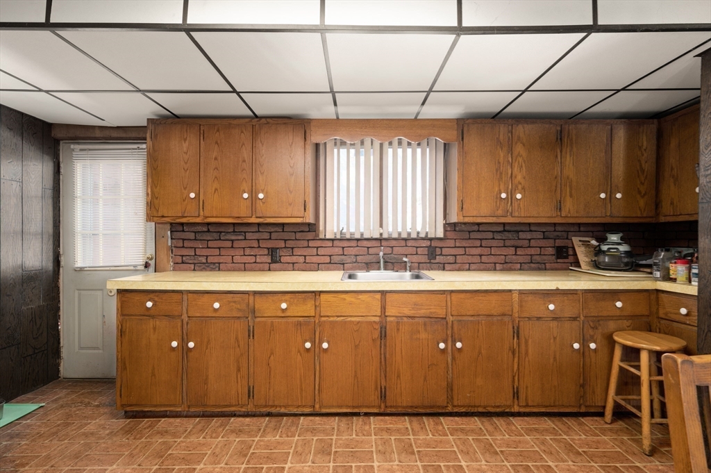 288 Cedar Street Somerville, MA 02145 - Photo 10 of 23 a kitchen with a sink and cabinets