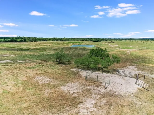 a view of a lake with houses in the back