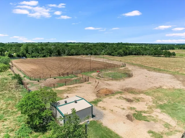 a view of a house with a yard and a garden