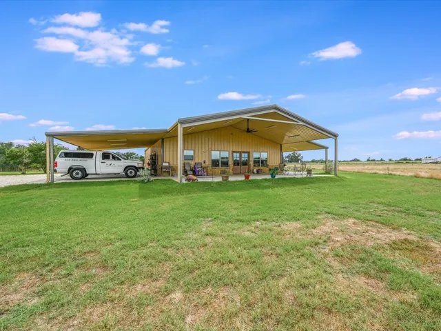 a view of a lake with a big yard