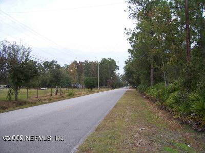 3380 Usina Road St. Augustine, FL 32084 - Photo 2 of 2 a view of a road with a yard