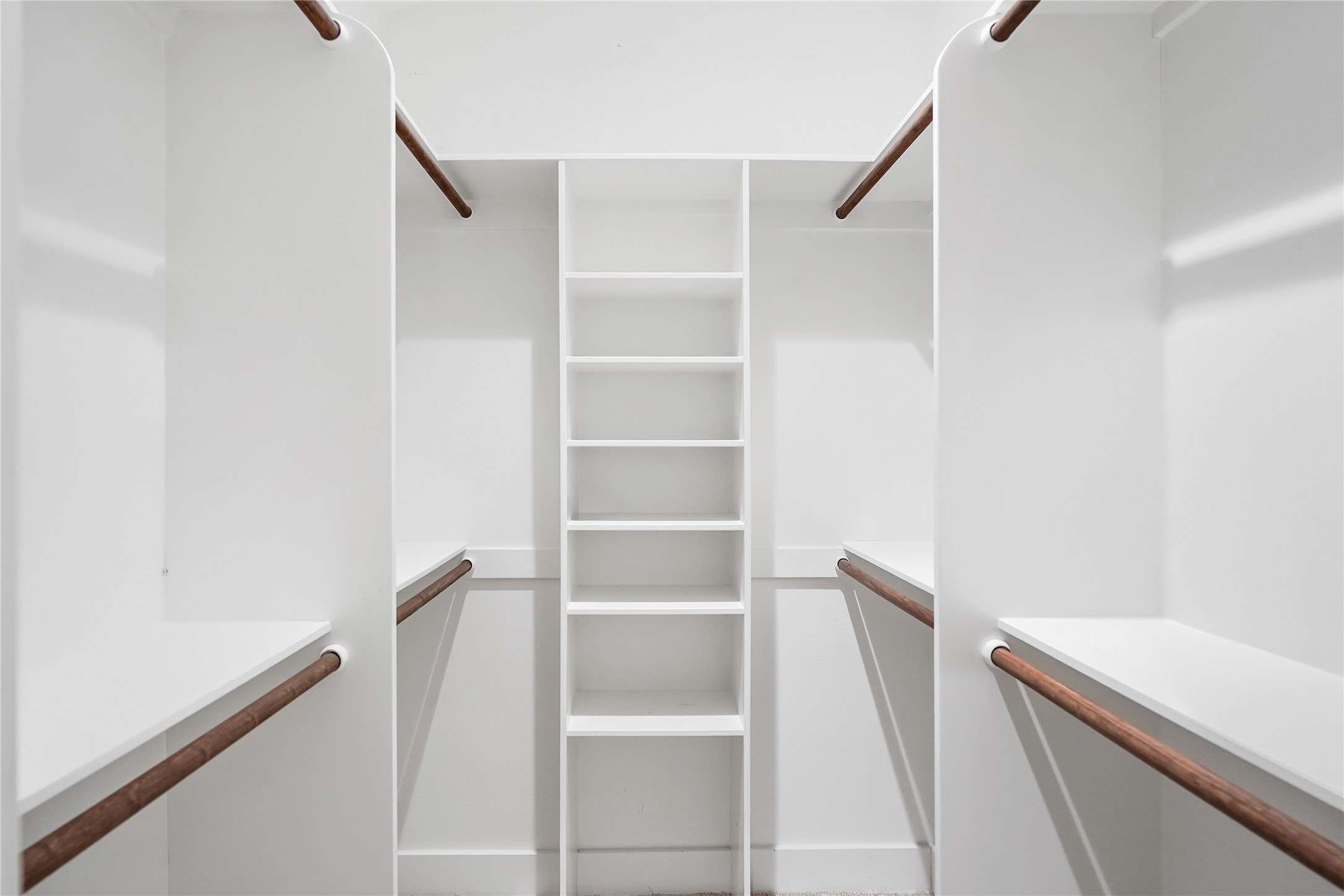 786 Beauchamp Road Dripping Springs, TX 78620 - Photo 20 of 40 Well-appointed closet featuring white shelving, hanging rods, and ample storage space