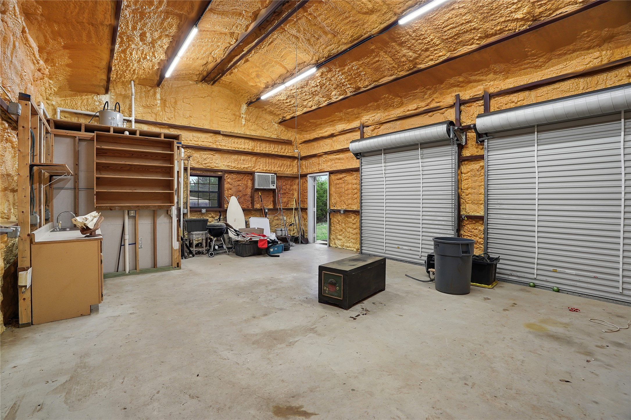786 Beauchamp Road Dripping Springs, TX 78620 - Photo 32 of 40 Spacious interior with concrete flooring and exposed ceiling beams