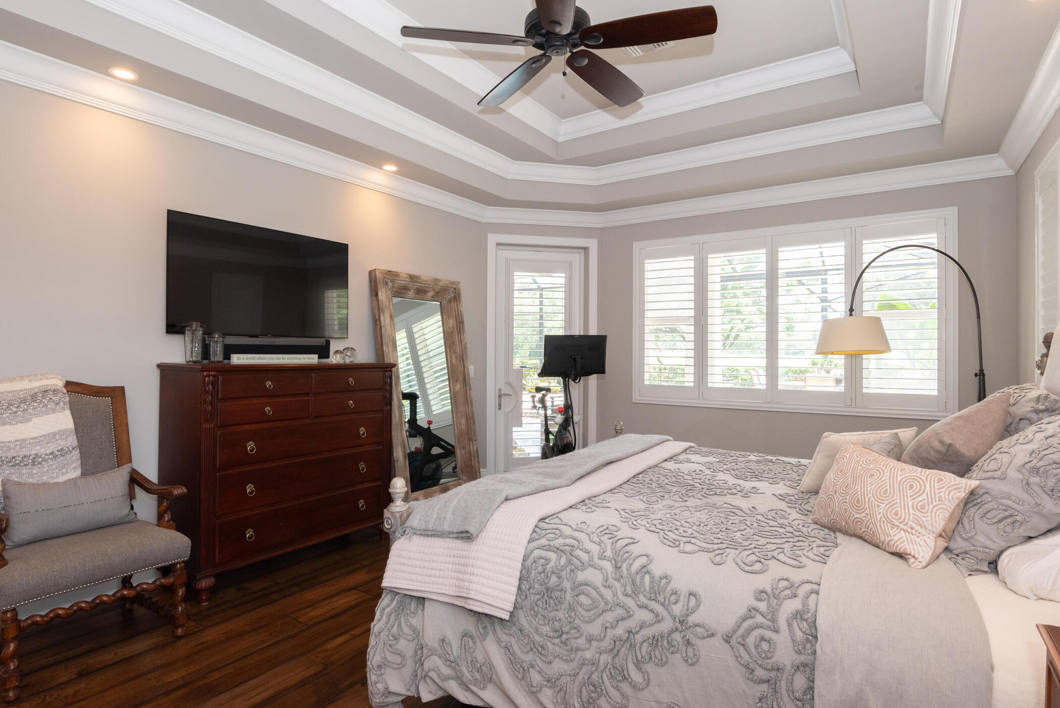 3420 Southeast Golf Trail Stuart, FL 34997 - Photo 24 of 63 a bedroom with a bed and a flat screen tv
