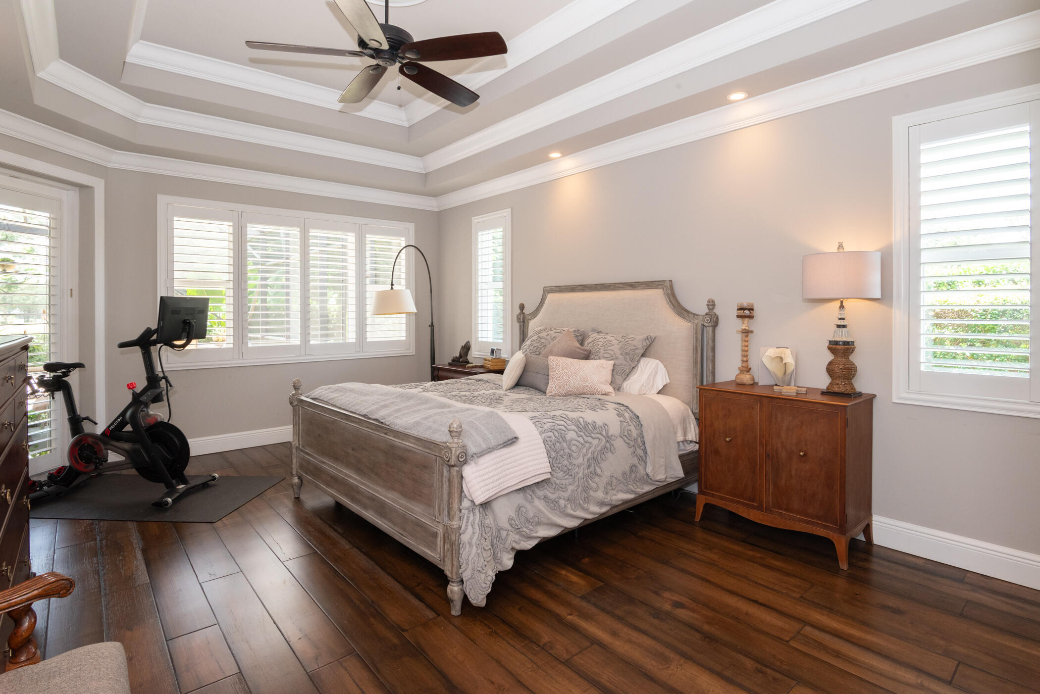 3420 Southeast Golf Trail Stuart, FL 34997 - Photo 26 of 63 a bedroom with a bed and wooden floor