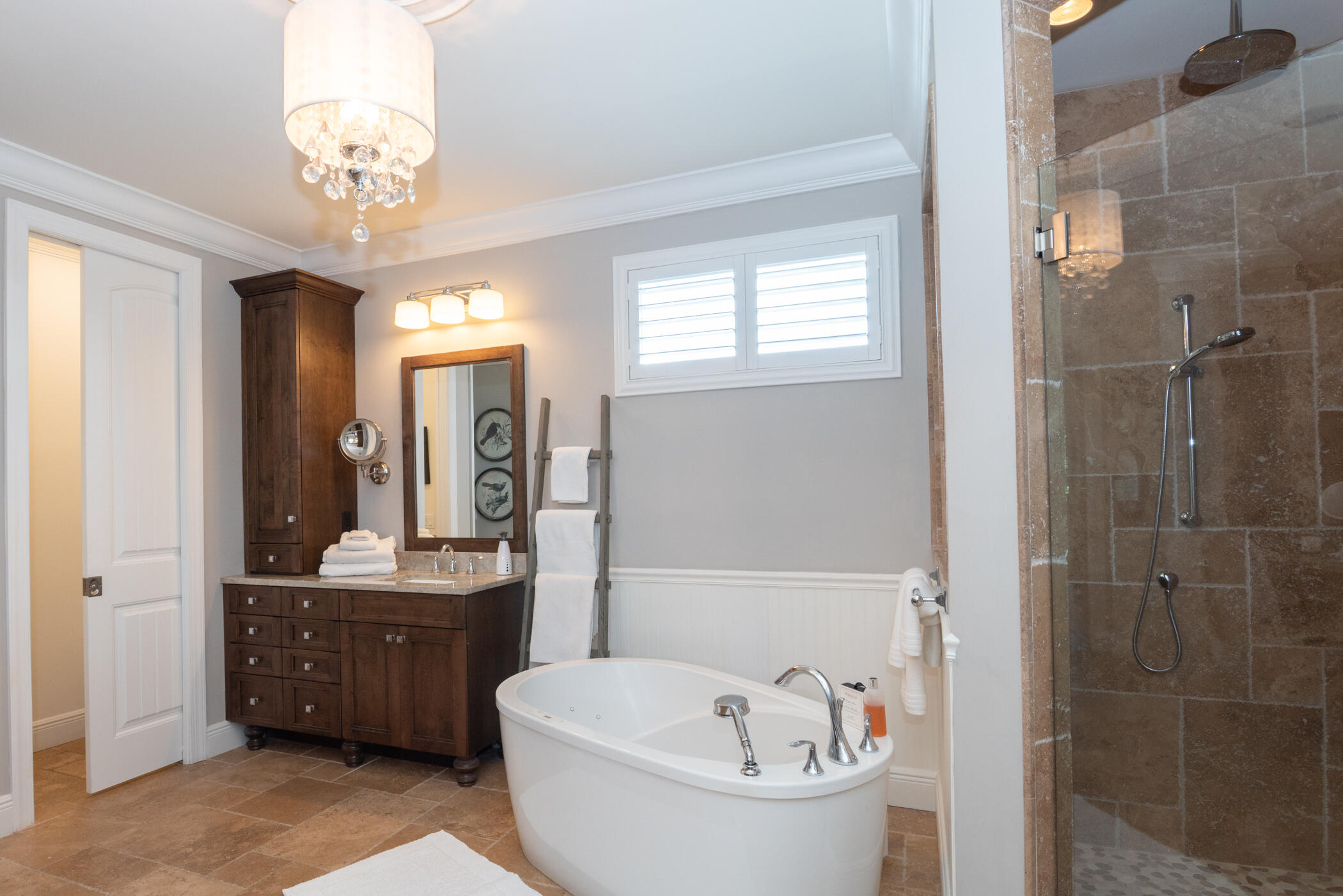 3420 Southeast Golf Trail Stuart, FL 34997 - Photo 30 of 63 a bathroom with a double vanity sink a toilet a mirror and shower