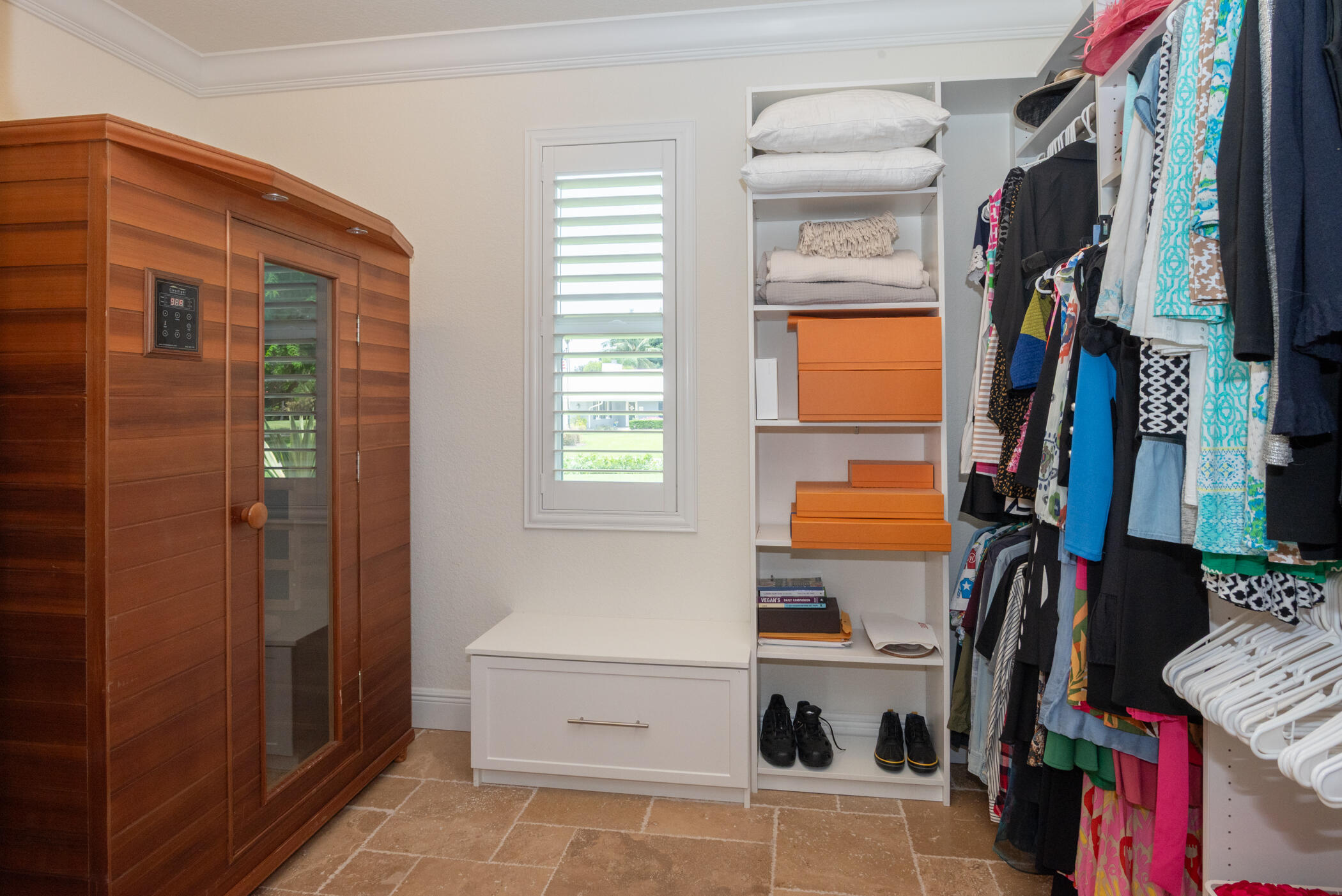 3420 Southeast Golf Trail Stuart, FL 34997 - Photo 31 of 63 a view of walk in closet with clothes and shoes