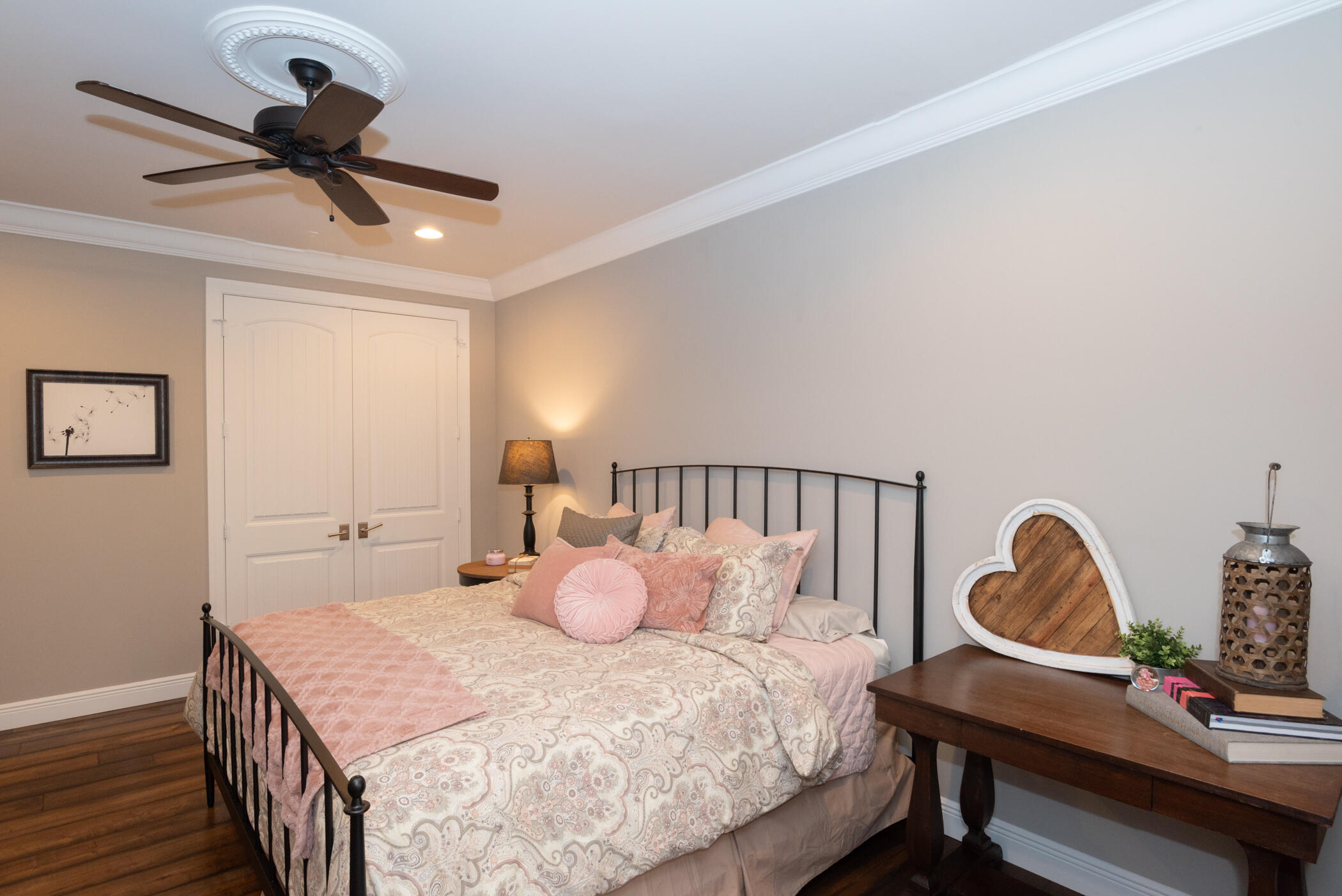 3420 Southeast Golf Trail Stuart, FL 34997 - Photo 35 of 63 a bedroom with a bed a desk and chair with wooden floor