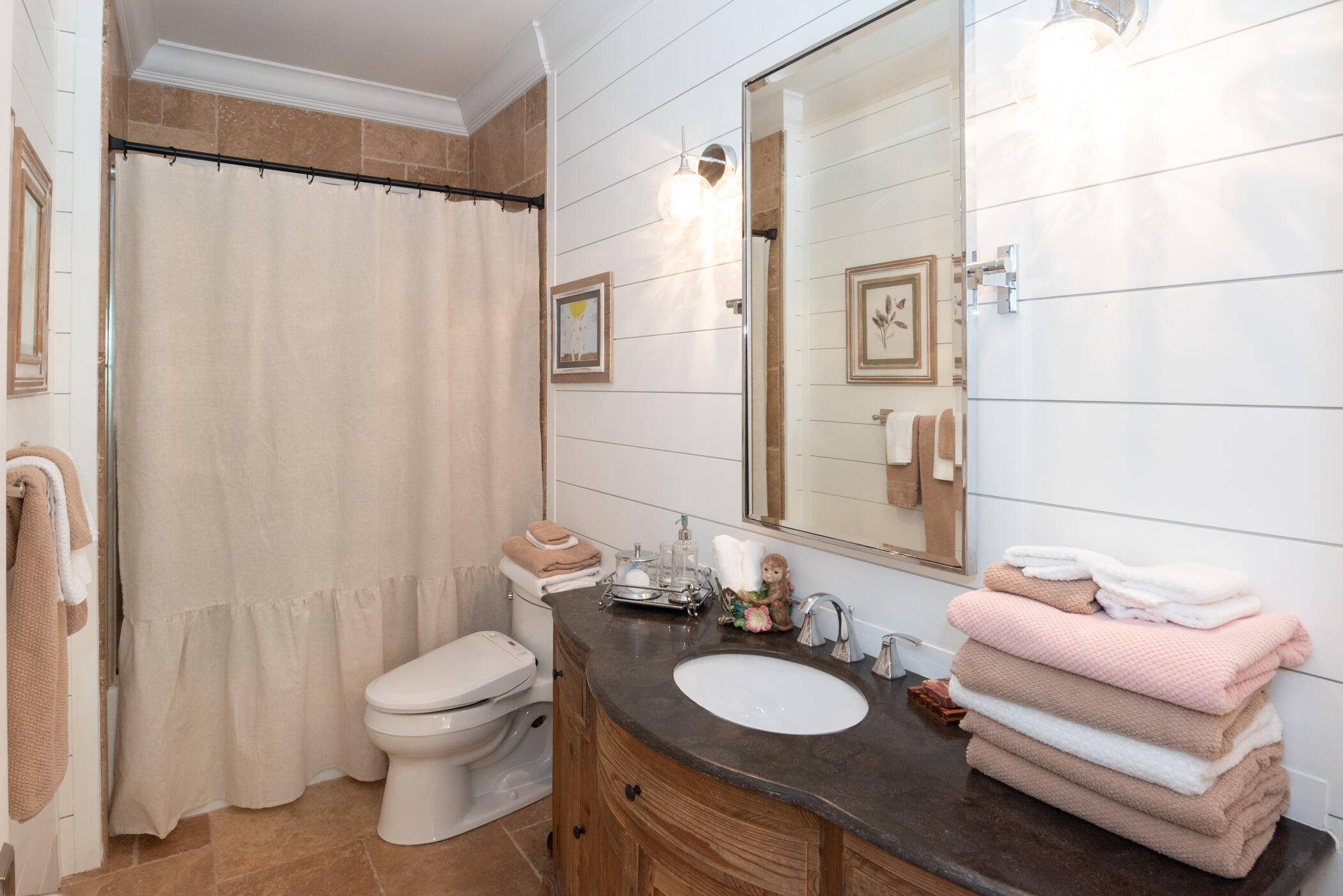 3420 Southeast Golf Trail Stuart, FL 34997 - Photo 36 of 63 a bathroom with a sink a toilet and a mirror