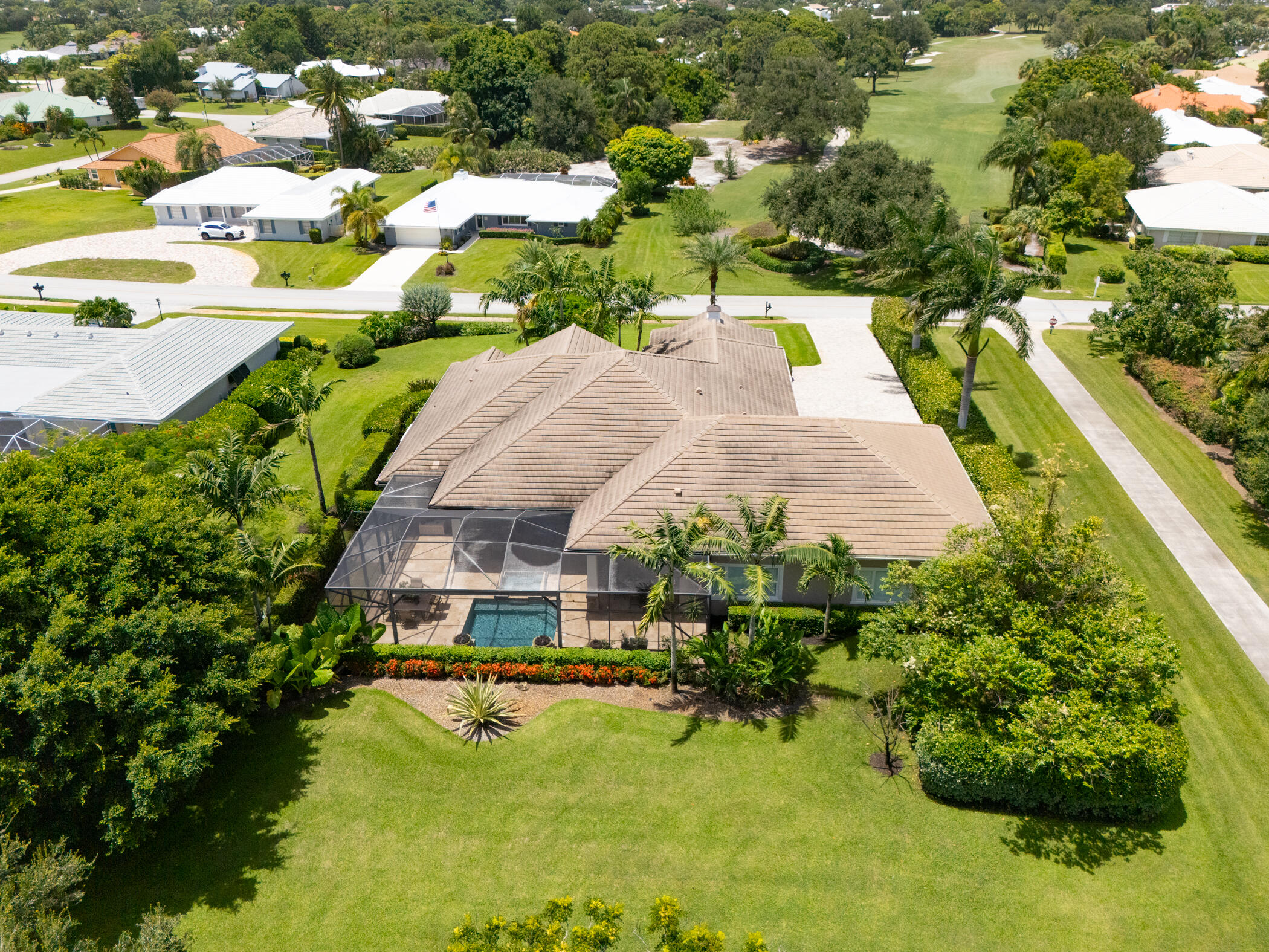 3420 Southeast Golf Trail Stuart, FL 34997 - Photo 48 of 63 an aerial view of a house with swimming pool and lake view