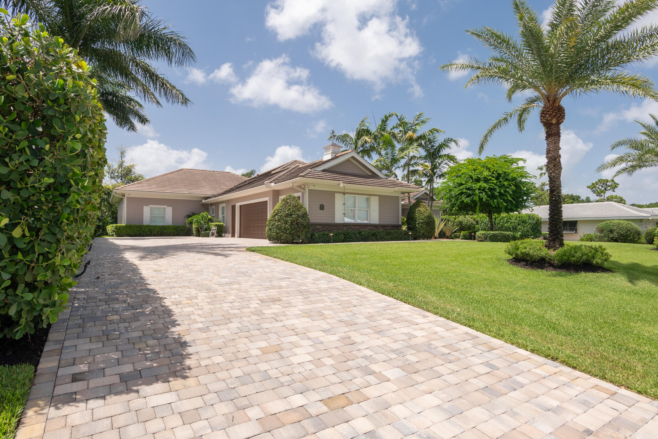 3420 Southeast Golf Trail Stuart, FL 34997 - Photo 49 of 63 a front view of house with yard and green space