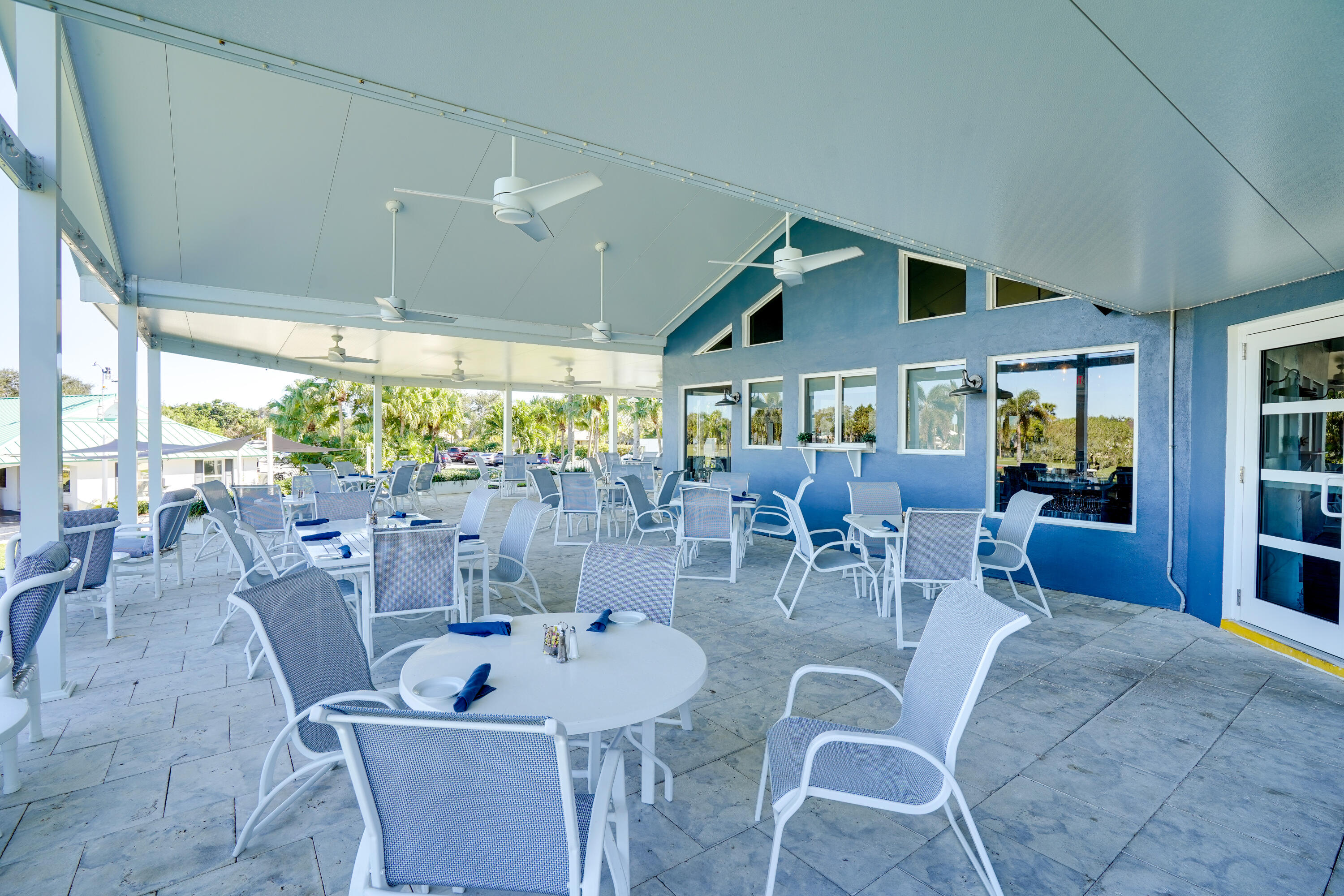 3420 Southeast Golf Trail Stuart, FL 34997 - Photo 55 of 63 a dinning table and chairs in a patio