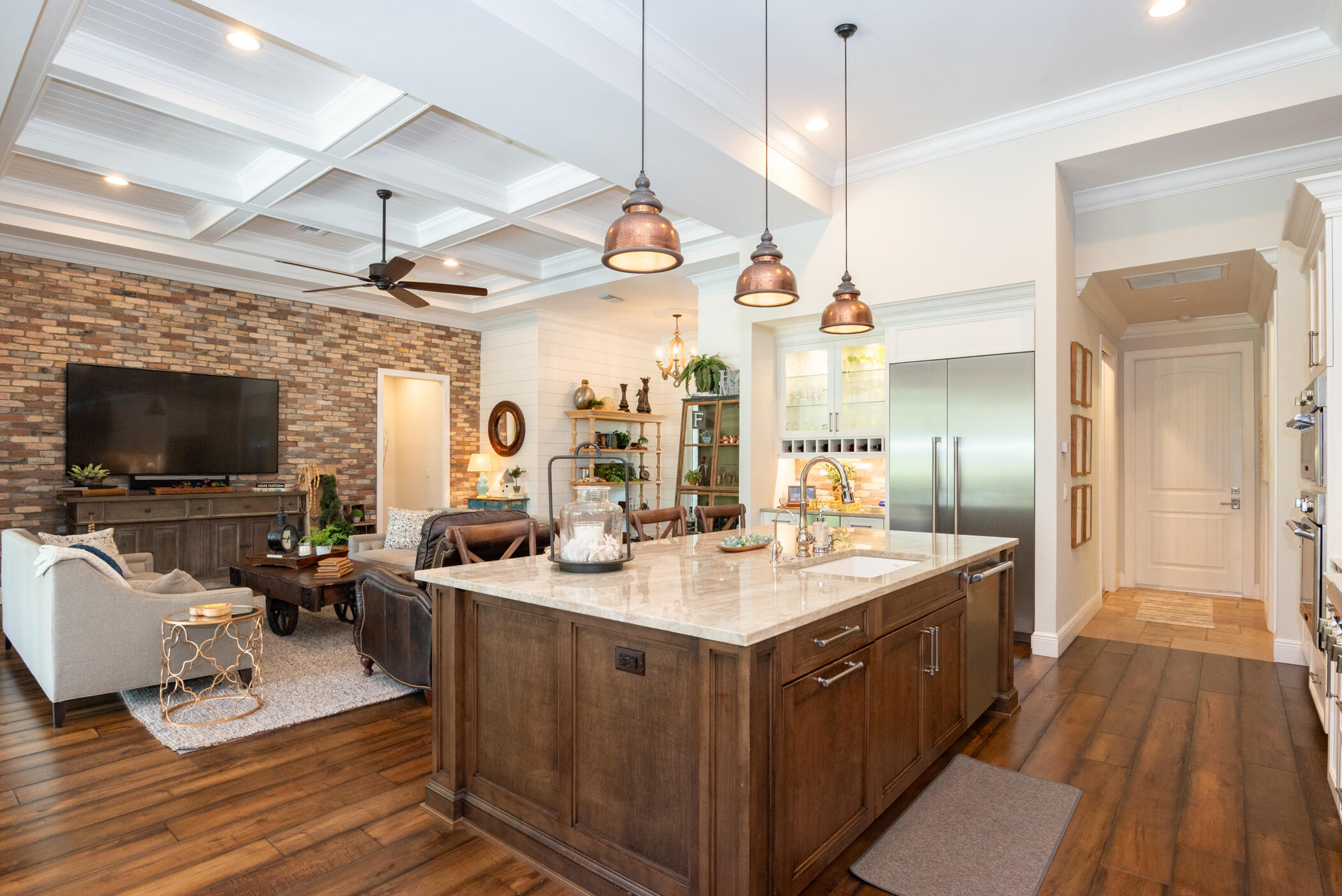 3420 Southeast Golf Trail Stuart, FL 34997 - Photo 10 of 63 a large kitchen with a sink and living room view