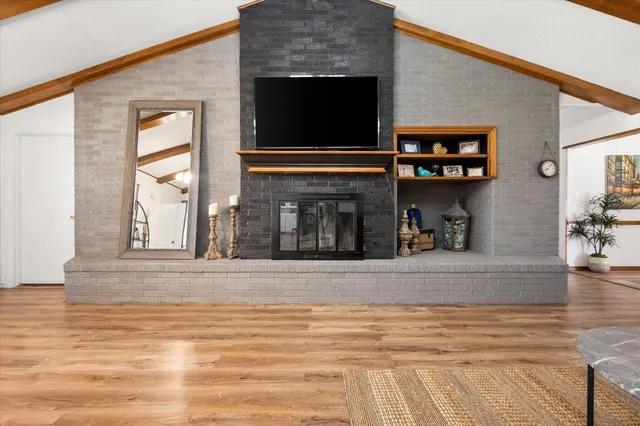 a view of a livingroom with furniture and a window
