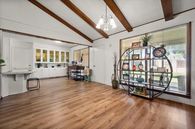 a bedroom with furniture and wooden floor