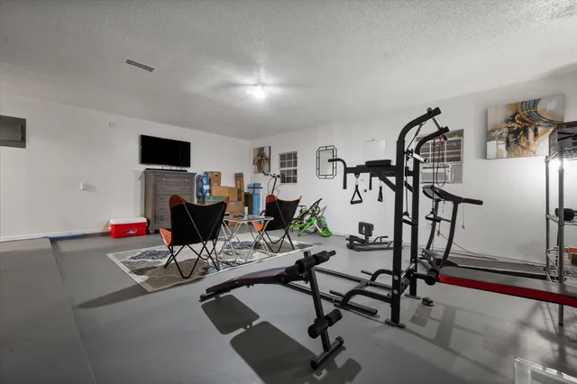 a view of a room with furniture and wooden floor