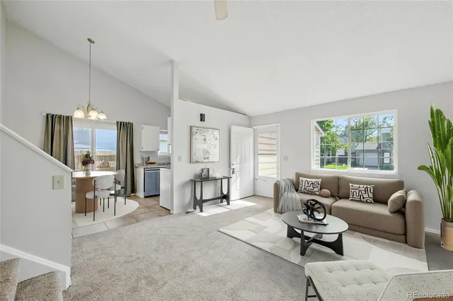 a living room with furniture and a table
