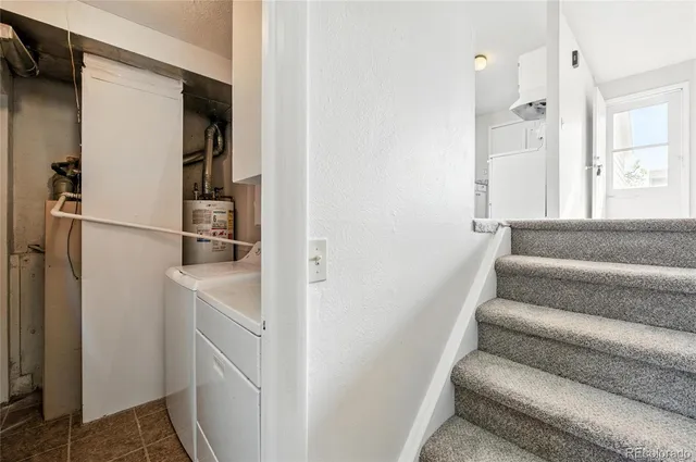 a bathroom with a granite countertop sink toilet a mirror a bathtub and shower