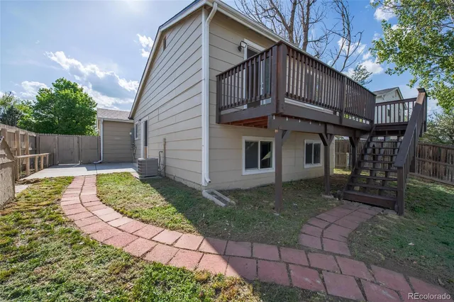 a view of a balcony with wooden floor