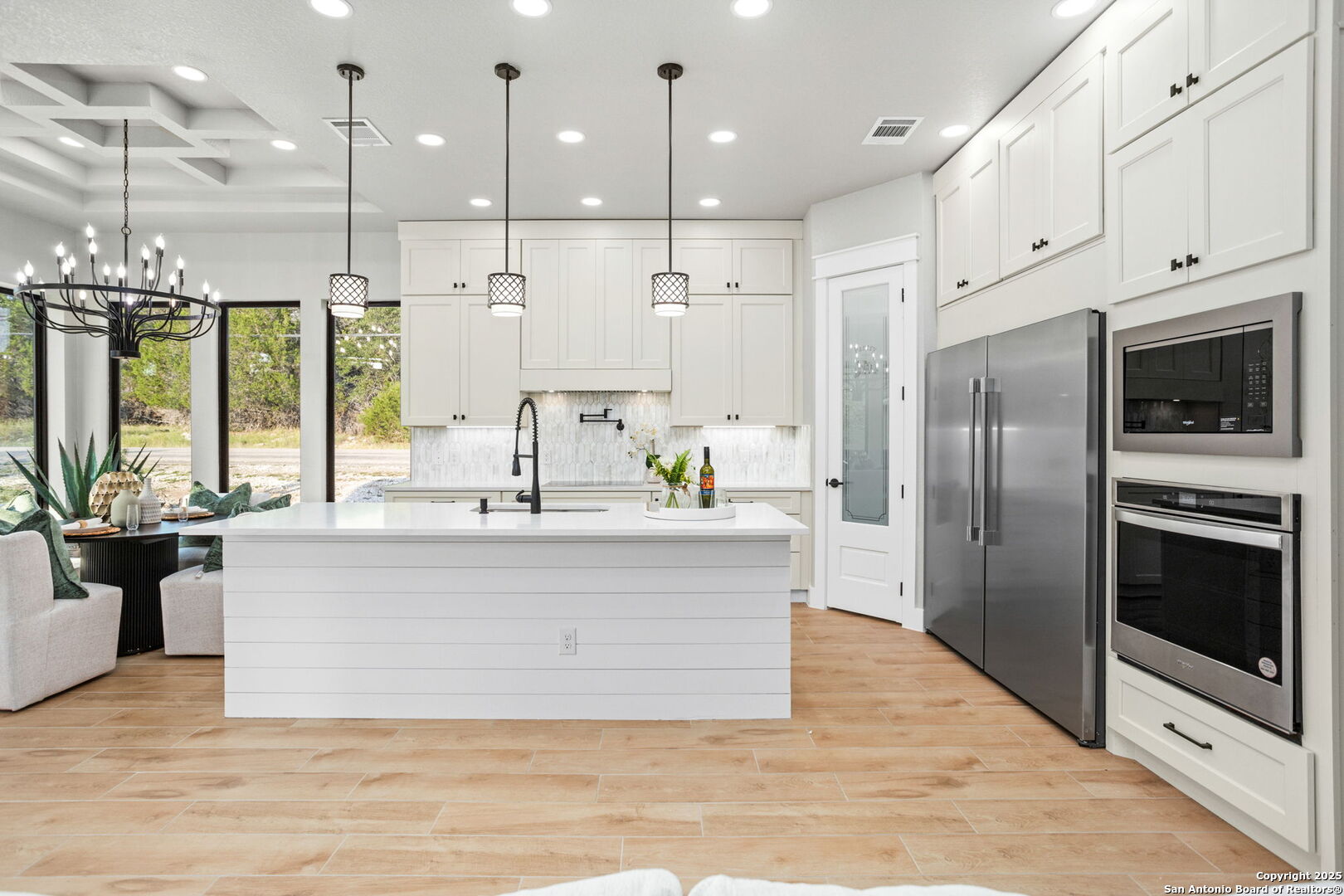 1475 Echo Meadow Lane Spring Branch, TX 78070 - Photo 11 of 25 a large white kitchen with stainless steel appliances
