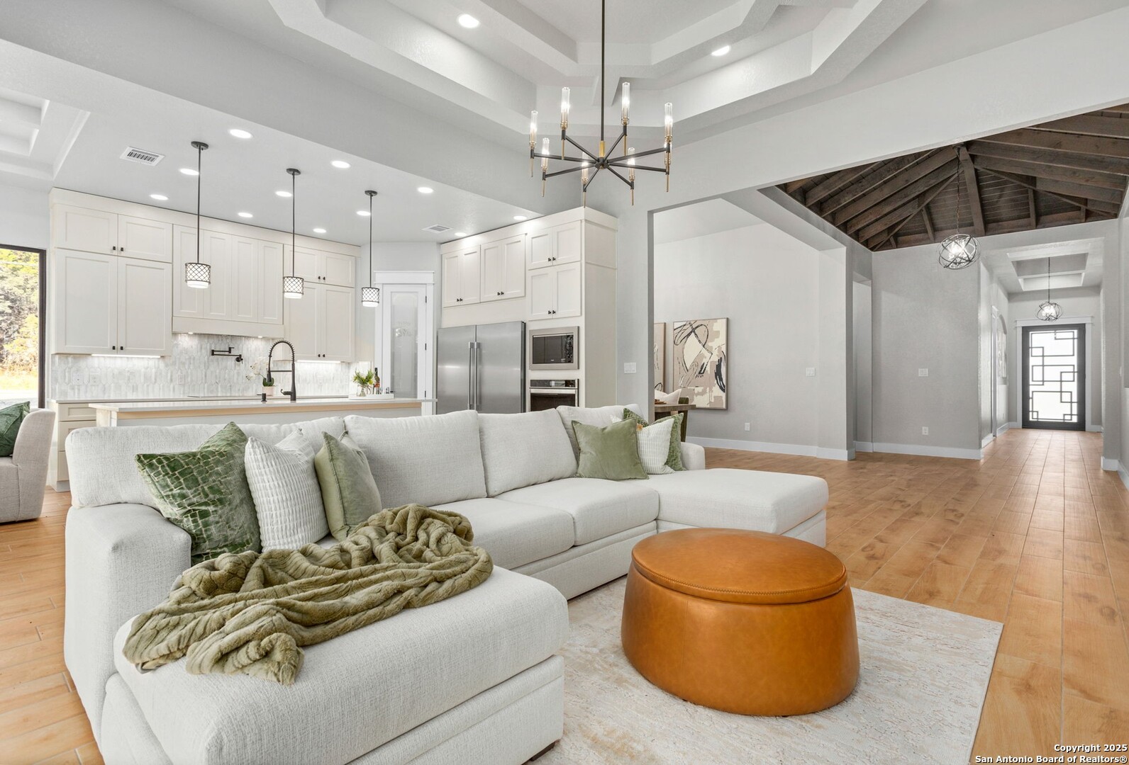 1475 Echo Meadow Lane Spring Branch, TX 78070 - Photo 8 of 25 a living room with furniture and a chandelier