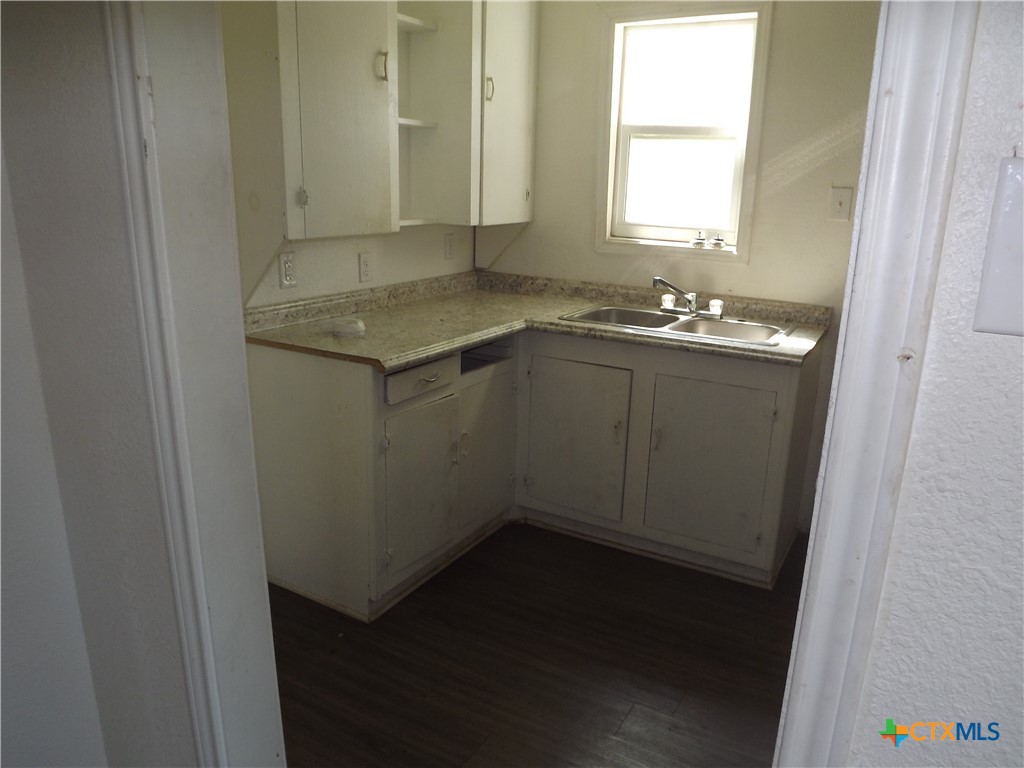 1714 Duncan Avenue Killeen, TX 76541 - Photo 8 of 24 a bathroom with a granite countertop sink and a mirror
