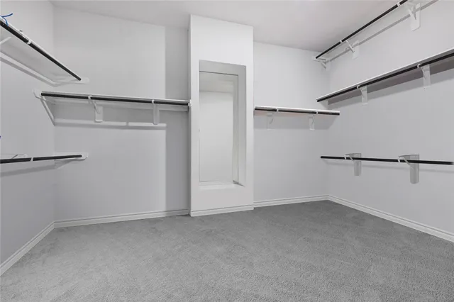 a bathroom with a shower a sink a toilet and a mirror