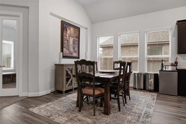 a kitchen with lots of counter top space and painting on the wall