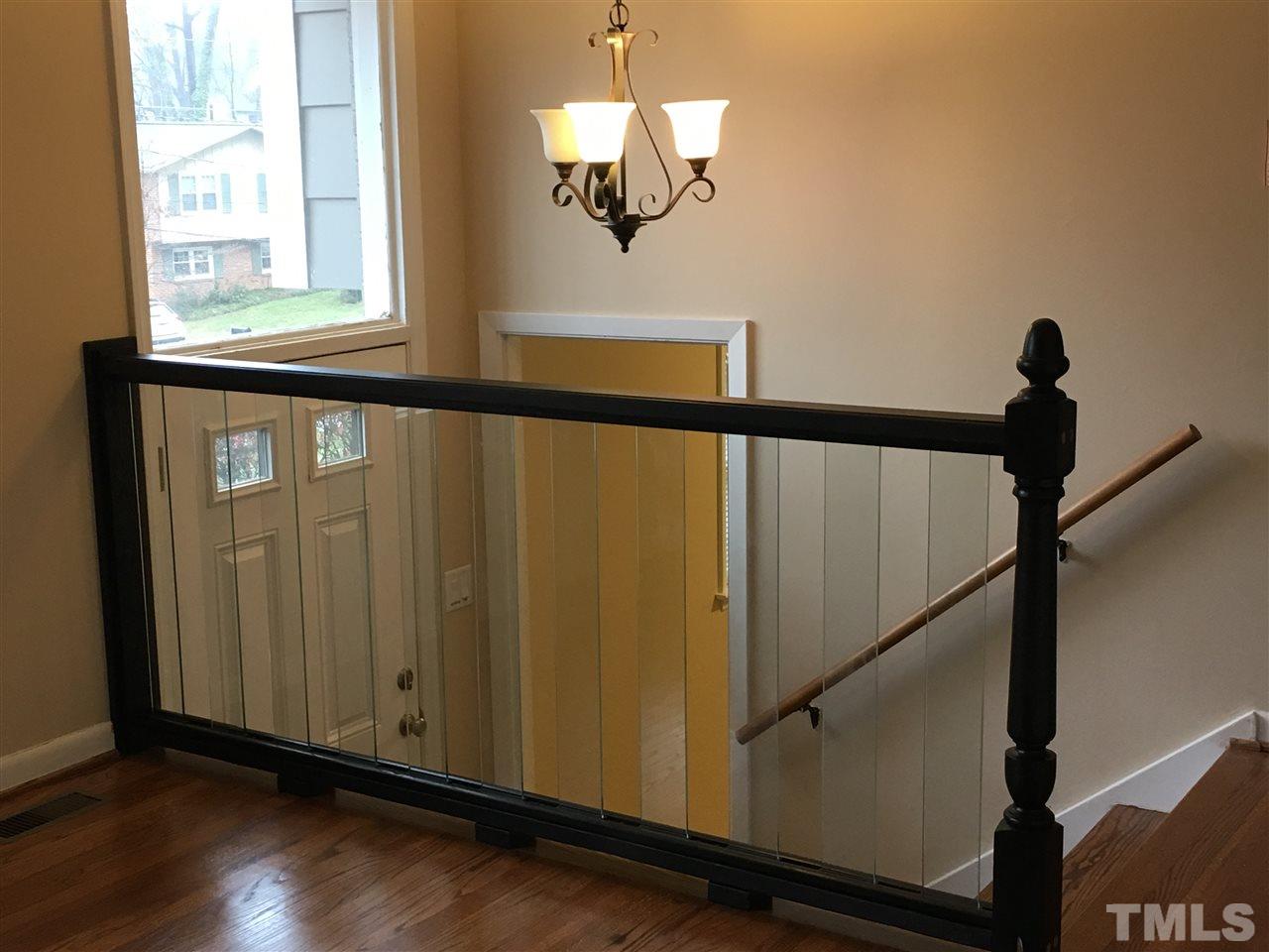 3404 Victor Place Raleigh, NC 27604 - Photo 2 of 22 a view of a hallway with window and wooden floor