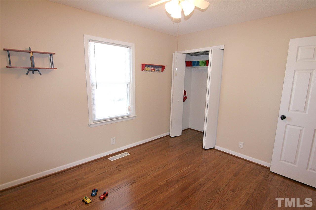 3404 Victor Place Raleigh, NC 27604 - Photo 13 of 22 wooden floor in an empty room with a window