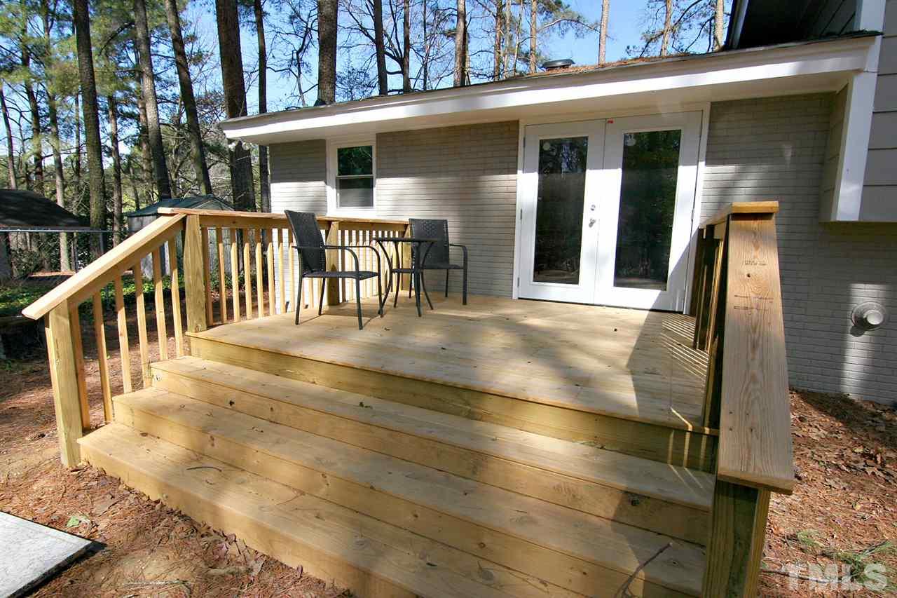 3404 Victor Place Raleigh, NC 27604 - Photo 19 of 22 a view of a house with large windows and a table and chairs