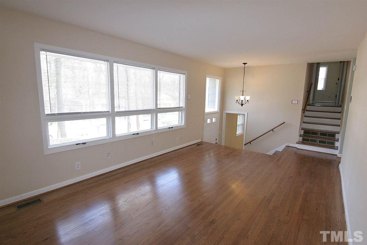 3404 Victor Place Raleigh, NC 27604 - Photo 3 of 22 a view of empty room with wooden floor and fan